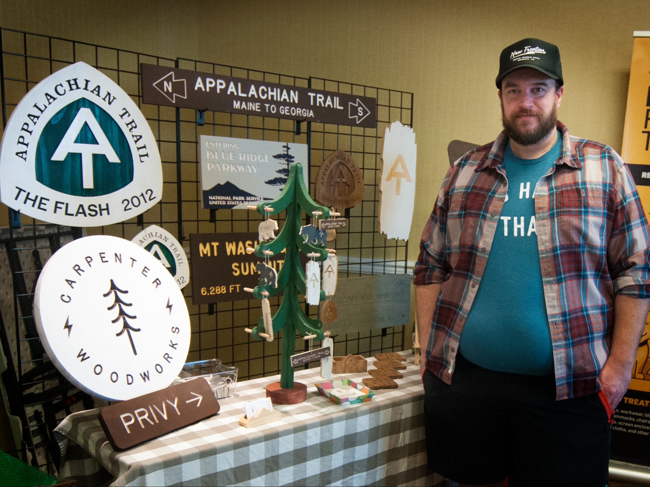 Vendor selling wood replica trail signs