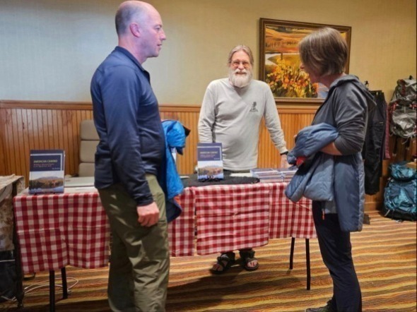 Author Kip Redick talks to visitors about his books